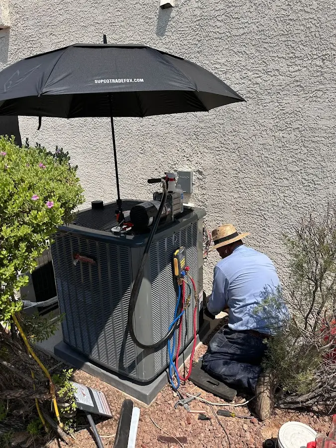 HVAC technician performing outdoor AC maintenance in Union